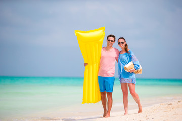 Young couple on white beach at summer vacation