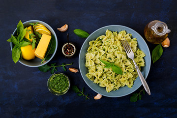 Vegan  Farfalle pasta in a basil-spinach sauce with garlic. Flat lay. Top view