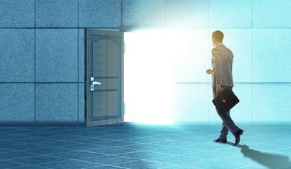 Fototapeta premium Businessman walking towards open door