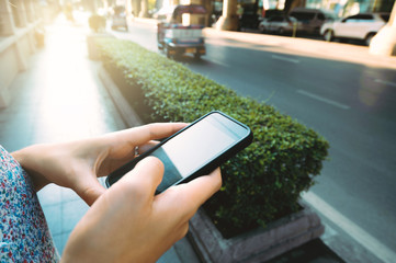 Close up of girl hands hoding modern smart phone
