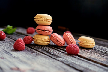 Delicious, colorful cookies on a wooden table.