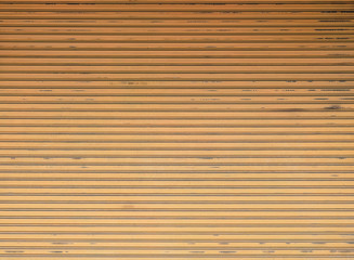 Orange roll gates,old shuttered roll up metal orange door