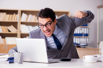 Angry businessman working in the office