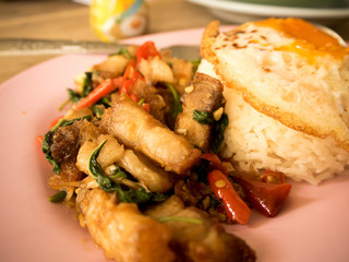 Traditional Thai dish crispy pork with a fried egg