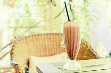 Ice Coffee on the wooden table. Vintage effect