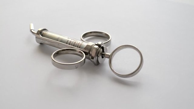 Vintage Syringe rotating on white background