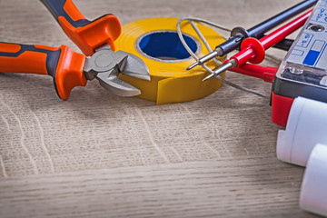 close up view electrical tools composition on wood background