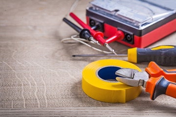 electrical tools composition on wood background