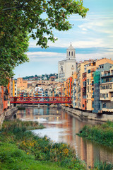 Fototapeta premium historical jewish quarter in Girona with Eiffel Bridge at sunrise, Barcelona, Spain, Catalonia