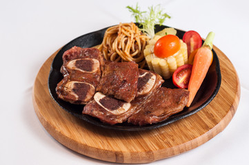 grilled beef rib with vegetables and noodles