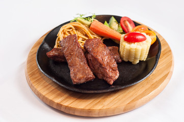 grilled steak with vegetables and noodles