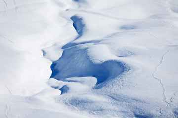 Winter mountains cowered with curving ski traces