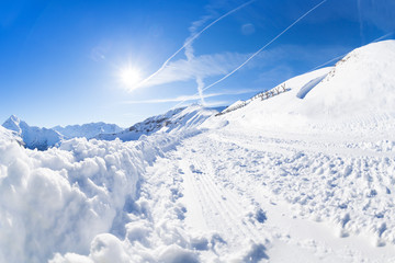 Beautiful mountain scene with snowy alpine path