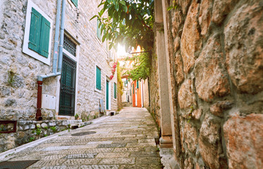 Fototapeta na wymiar Narrow streets of historical old town Herceg Novi, Boka Kotor gilf. Popular touristic route to Kanli Kula fortress, Montenegro.