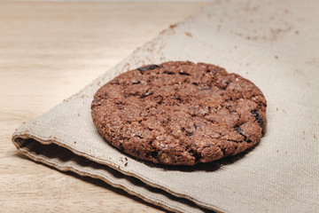 Pastry biscuits on linen napkin on wooden table