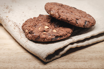 Pastry biscuits on linen napkin on wooden table