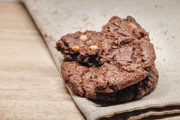 Pastry biscuits on linen napkin on wooden table