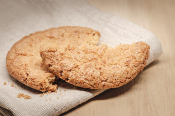 Pastry biscuits on linen napkin on wooden table