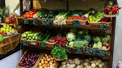 Fresh fruits and vegetables in crates in the produce aisle