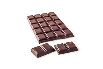 A piece of chocolate with chocolate bar isolated on white background