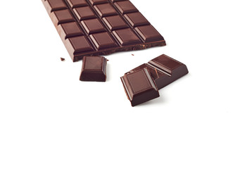A piece of chocolate with chocolate bar isolated on white background