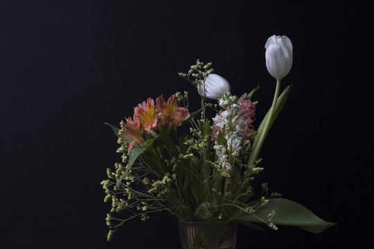 Bouquet with tulips on a dark background
