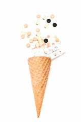 pills, drug capsule in waffle cone isolated on white background
