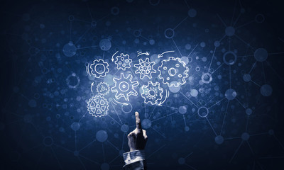 Glowing cogwheel mechanism icon on dark background as symbol of 