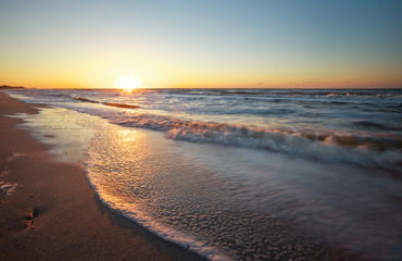 Fototapeta na wymiar Sunset and ocean. Beach and sea at sunrise.