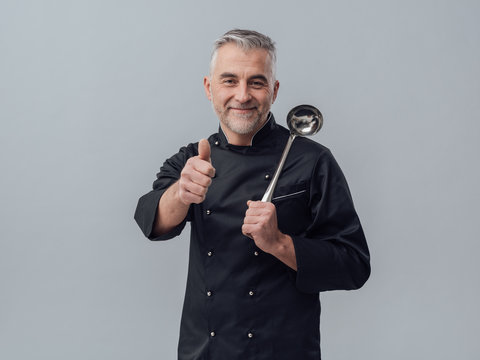 Chef posing with a spoon ladle