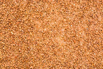 Natural brown stones wall background.