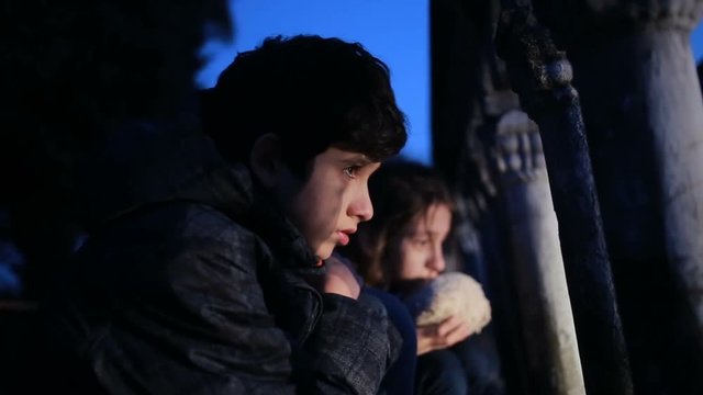 Children refugees against the backdrop of bombed houses. war