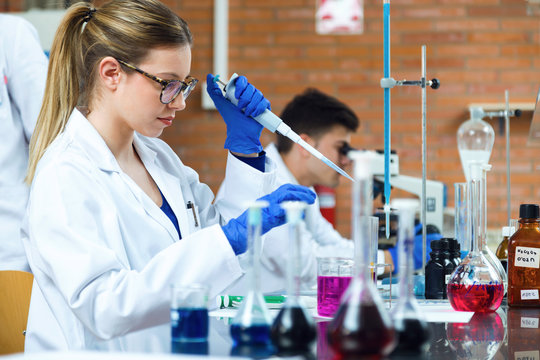 Young scientists carrying out an experiment in a laboratory.