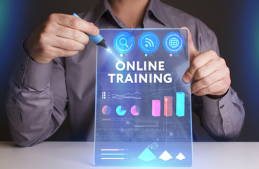 Business, Technology, Internet and network concept. Young businessman working on a virtual screen of the future and sees the inscription: Online training