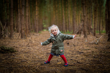 Young Girl playing in woods