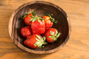 strawberries in wooden bowl