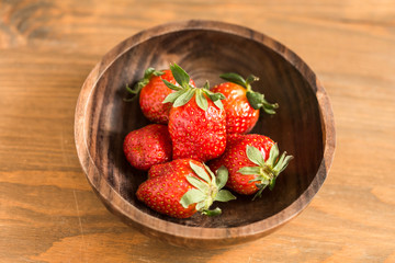 strawberries in wooden bowl