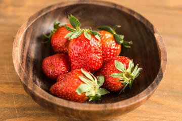 strawberries in wooden bowl