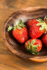 strawberries in wooden bowl