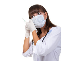 Doctor or nurse in face mask and lab coat holding syringe. Isolated over white.