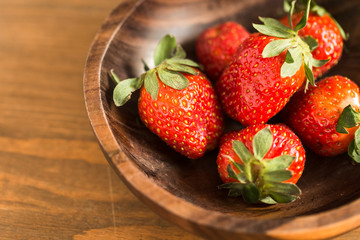 strawberries in wooden bowl