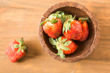 strawberries in wooden bowl