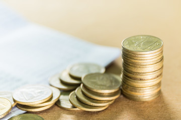 thai coins and account book ,concept of saving and investment