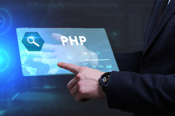 Business, Technology, Internet and network concept. Young businessman working on a virtual screen of the future and sees the inscription: PHP