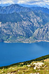 Fototapeta na wymiar Aerial view of a nice mountain view Garda Lake nad Malcesine city from the trail at Monte Baldo in Italy.