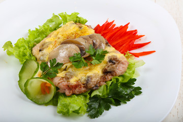 Pork steak with mushroom and cheese
