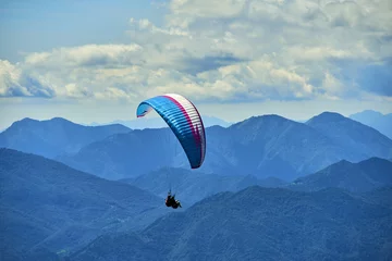 Tuinposter Paragliding is a popular activity on Lake Garda. Taking off from Monte Baldo © Petr Bonek