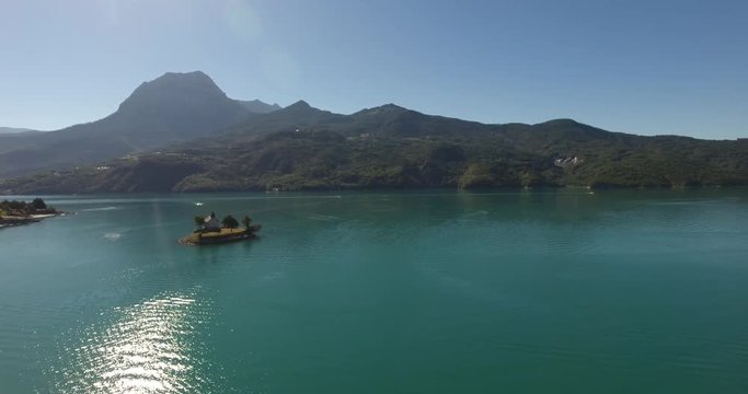 Aerial inspirational island on lake mountains serre pon&ccedil;on alps