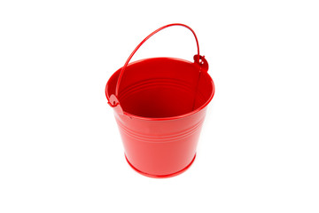 Red iron bucket with handle isolated on white background. Empty metal pail. Colorful kid child toys. Garden equipment. Red container. Handle down, top, side view.