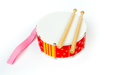 Red – yellow drum with drum sticks isolated on white background. Musical instrument, Drum toy for kids. Top, side view,